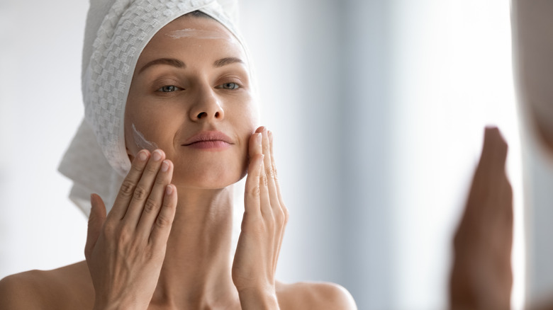 Woman cleaning her face