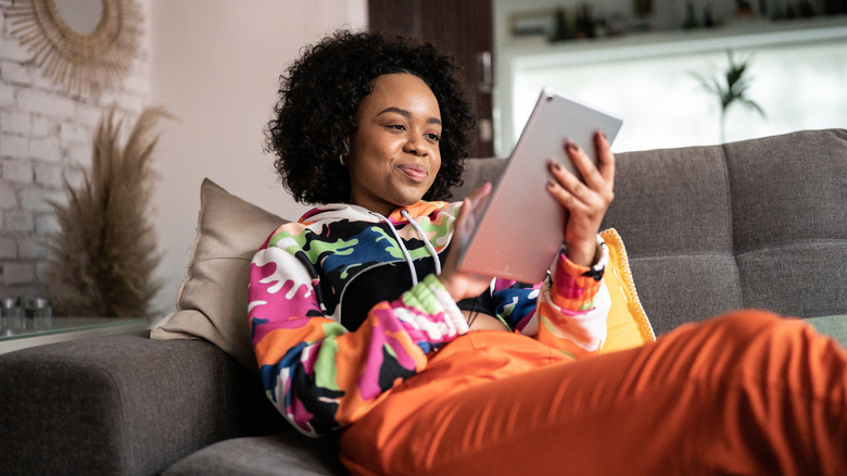 Woman reading on her kindle