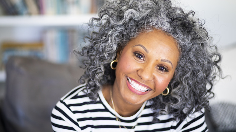 Woman with curly gray hair