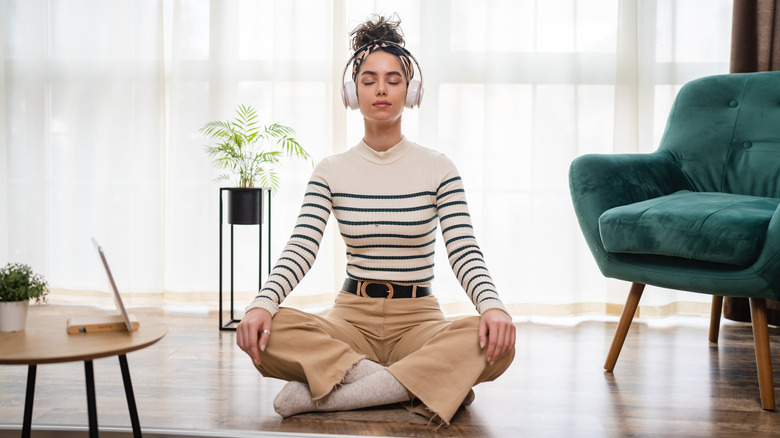 Person on the floor meditating