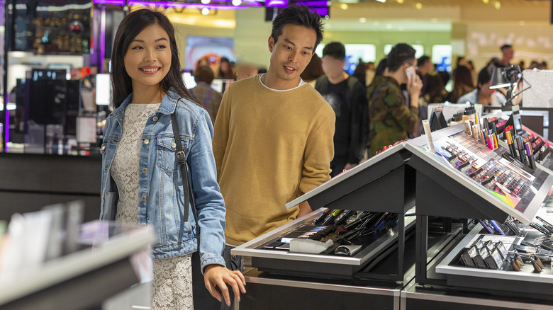 Couple shopping for makeup