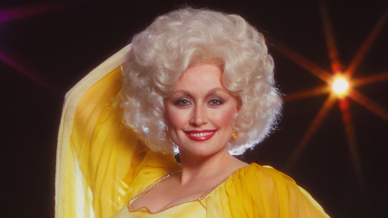 Dolly Parton wearing a yellow dress
