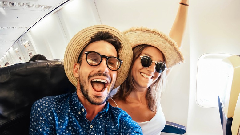 Happy couple on plane