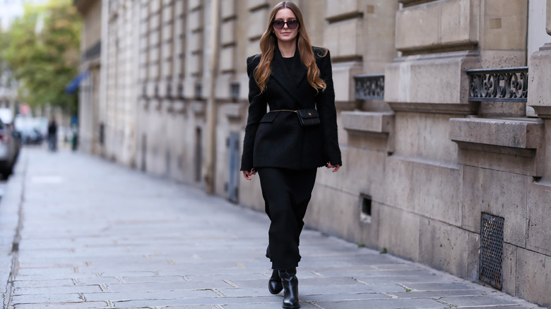 Woman wearing black blazer, pants