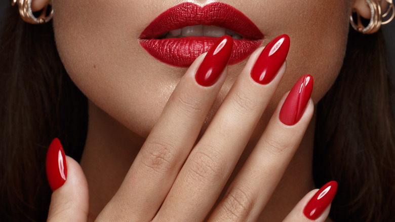 woman with long red nails