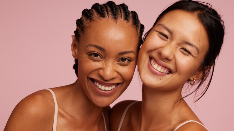 Two women smiling happily