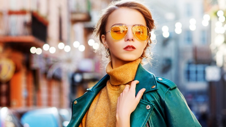Girl wearing yellow aviator sunglasses