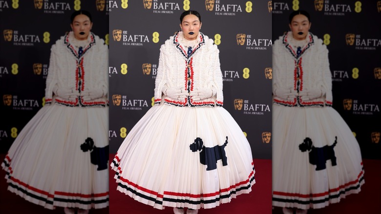 Audrey Nuna stands on the red carpet while photos are being taken