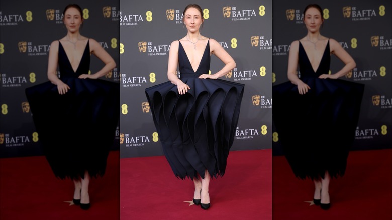 Erin Doherty stands on the BAFTAs 2026 red carpet