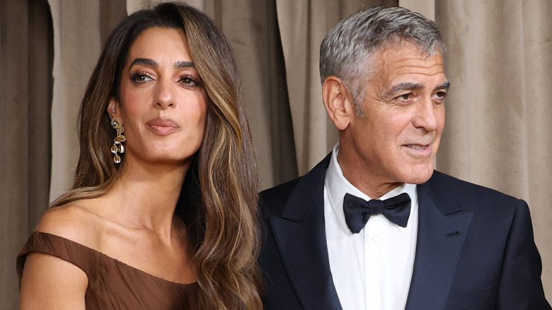George Clooney and Amal Clooney attend the Clooney Foundation For Justice's The Albies at The Natural History Museum on October 3, 2025 in London, England (2025)