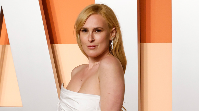 Rumer Willis wearing a gown with a white top and delicate earrings at the 2025 Vanity Fair Oscars party.