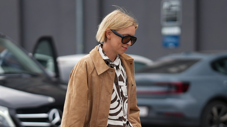 A guest is outside at a show during Copenhagen Fashion Week day four on August 7, 2025