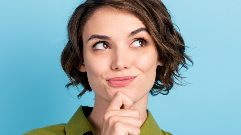 thoughtful woman with short hair