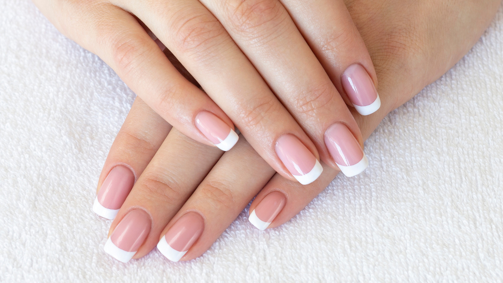 4. "Consider a classic French manicure for a timeless and polished look" - wide 1