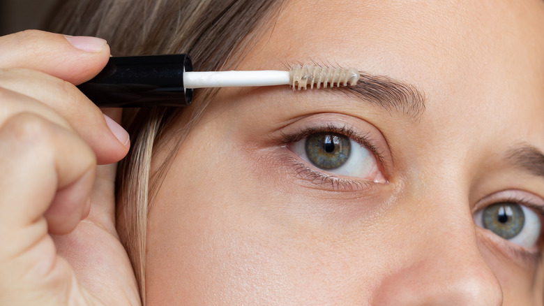 combing eyebrows