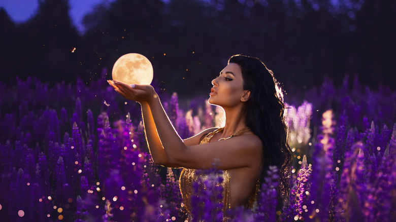 Woman with moon in hands
