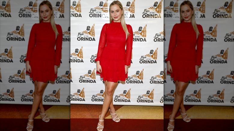 Natasha Bure in red dress in 2021