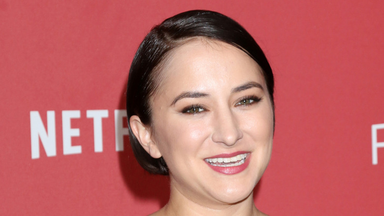 Zelda Williams in a black dress poses for a photo at the Patron of the Artists Awards 2017