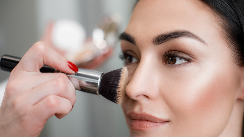 Woman getting her makeup done