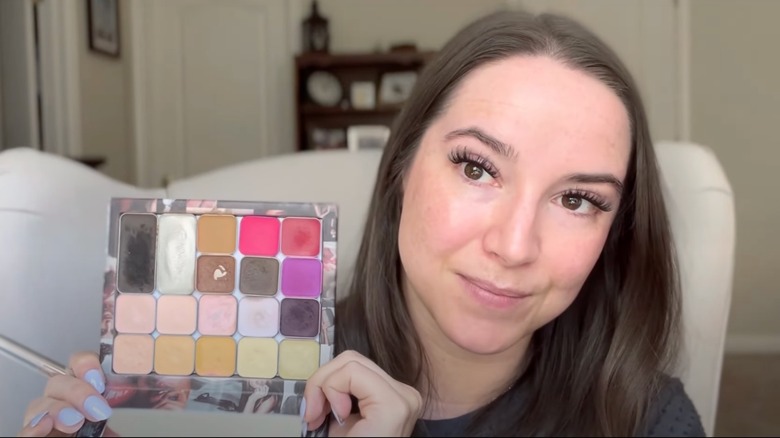 woman holding color correcting palette
