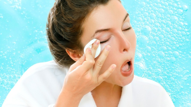 Woman cleaning her eyelashes