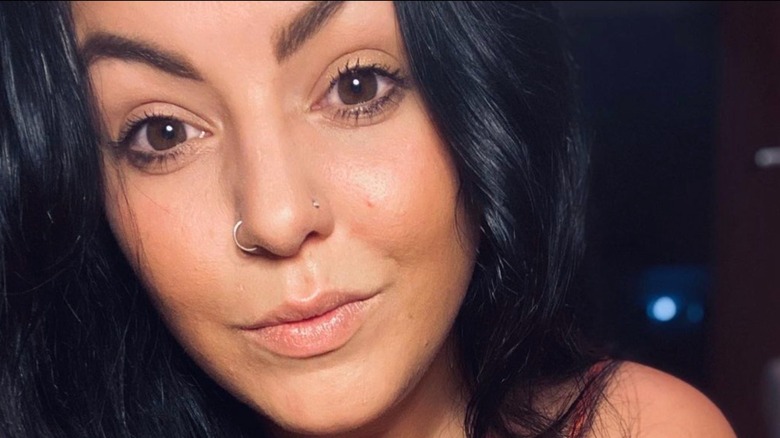 Woman with two nostril piercings