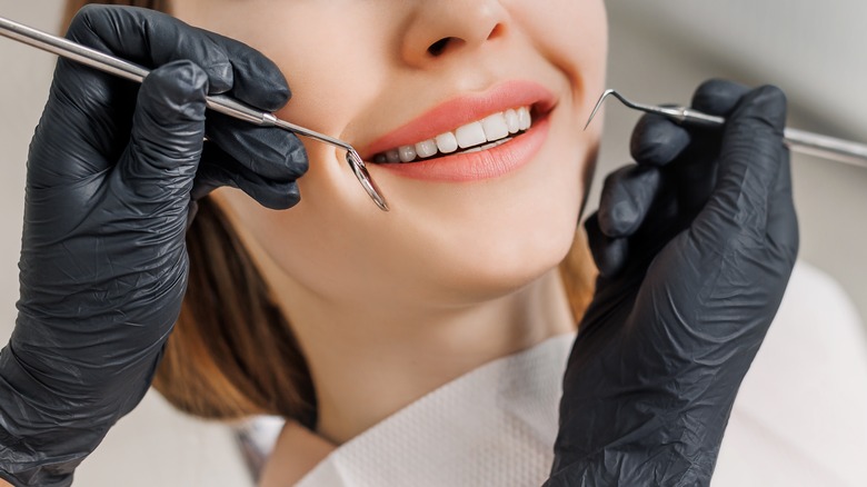 Dentist working woman's teeth