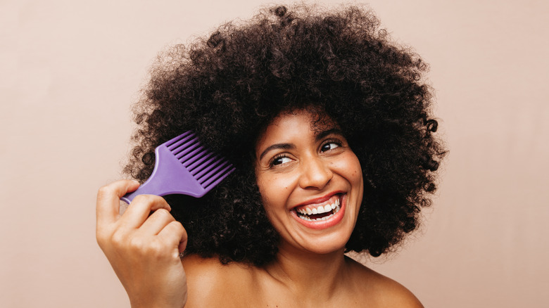 Smiling woman with afro