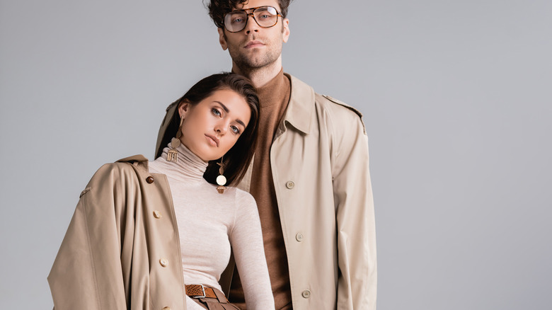 Couple wearing trench coats