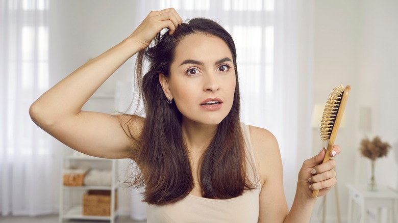 woman touching her hair