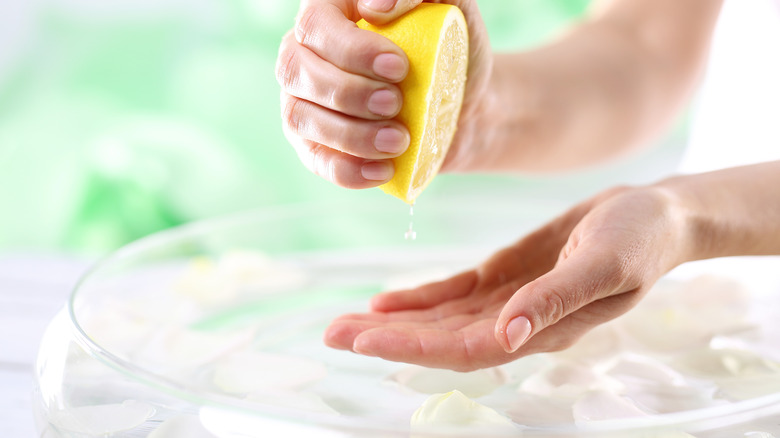 woman squeezing lemon juice 
