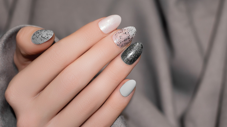 silver and black glitter manicure