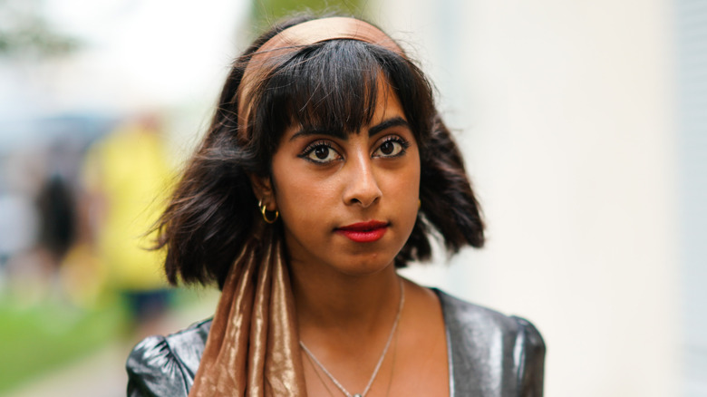 woman with black hair and bands