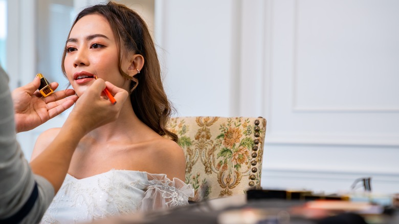 Woman getting her makeup done