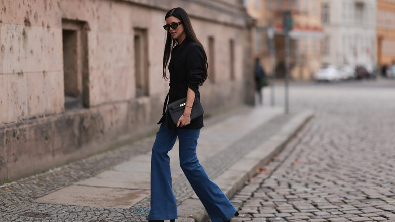 Woman wearing flared denim jeans
