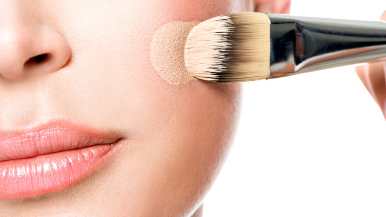 foundation being applied to face