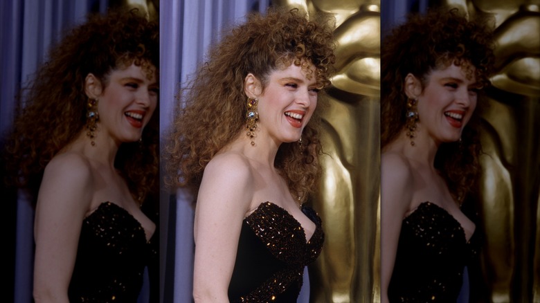 Bernadette Peters attends the 1987 Academy Awards wearing a voluminous curly style
