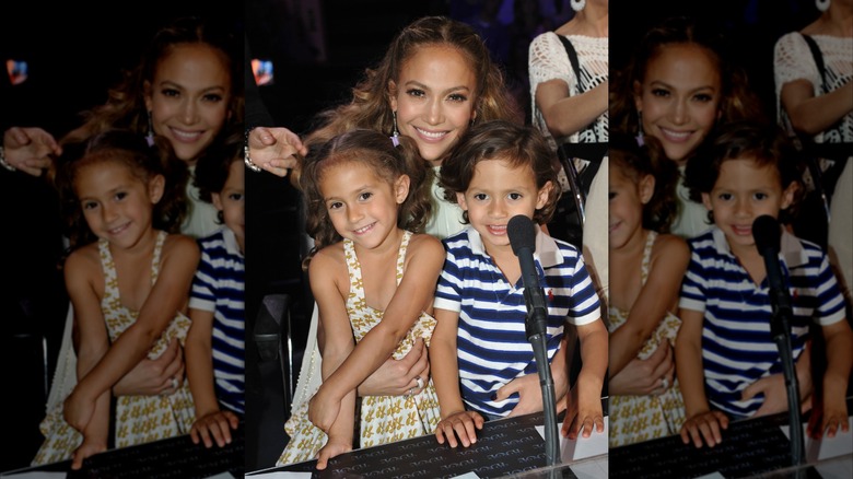 Emme and Max sit in Jennifer Lopez's lap