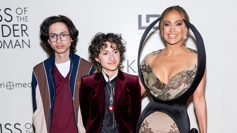 Max, Emme, and Jennifer Lopez smile together on red carpet