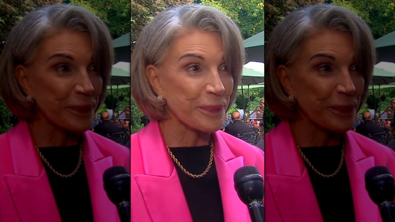 Hilary Farr with gray hair and a pink blazer