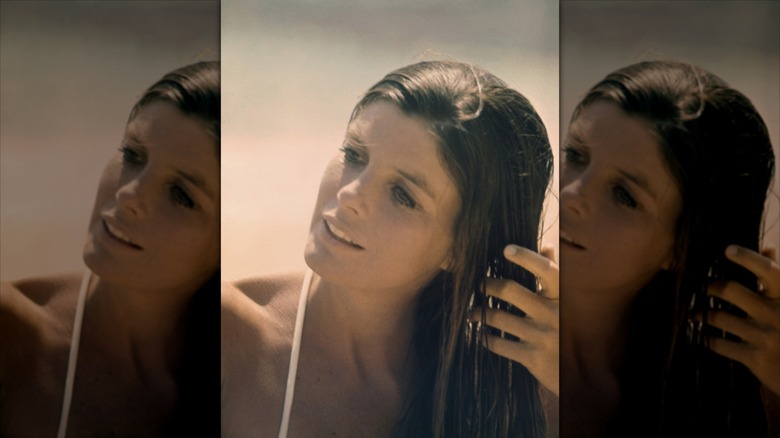 Katharine Ross running her hand through her wet hair.