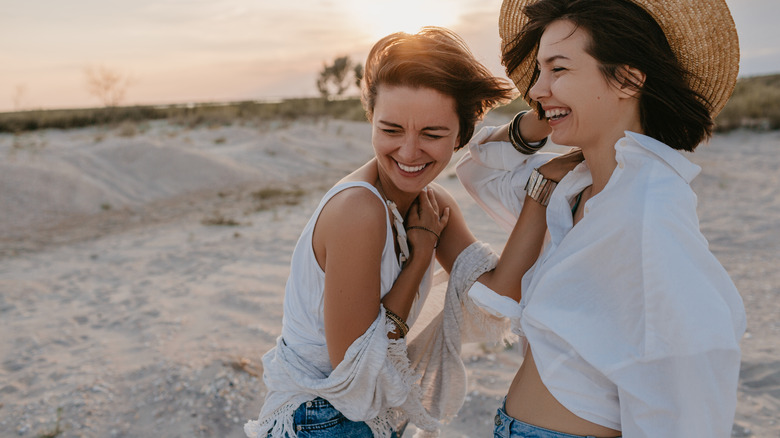 Women laughing beach