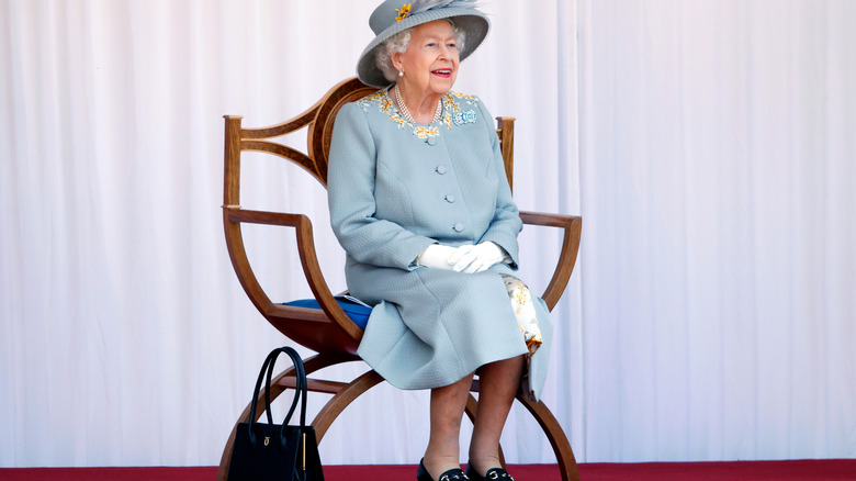 Queen Elizabeth with black handbag