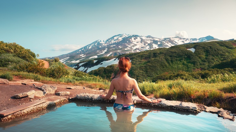 Woman soaking in hot spring