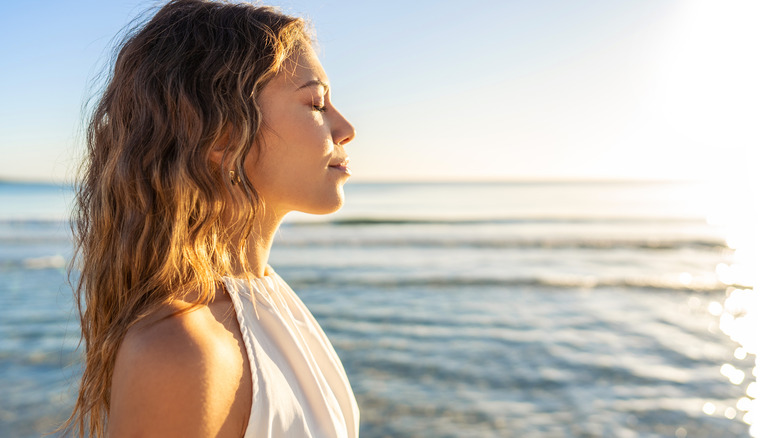 Woman standing in the sun