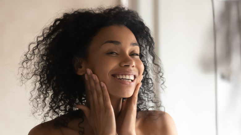 woman applying skincare