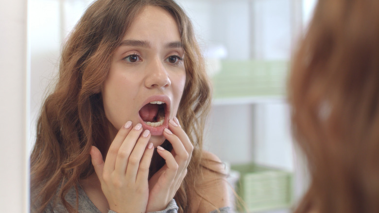 person looking in their mouth