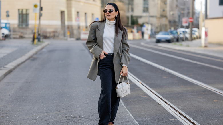 woman wearing blazer and jeans