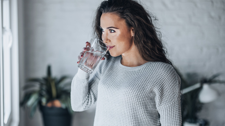 healthy woman drinks water