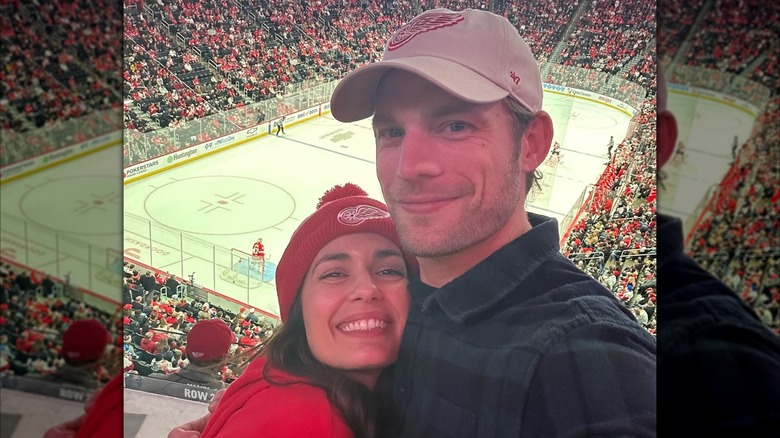 Torrey DeVitto and Jared LaPine at a hockey game